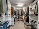 Organize your wardrobe in this expansive walk-in closet with shelving and hanging space for all your clothes at 4316 Falls Lake Sw Dr, Concord, NC 28025