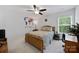 Bedroom features a large window, ceiling fan, and a view of the backyard at 5384 Gatsby Cir, Rock Hill, SC 29732