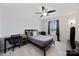 Cozy bedroom with carpeting, a ceiling fan and a large window offering natural light at 5384 Gatsby Cir, Rock Hill, SC 29732