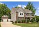 Lovely two-story home with brick and siding, a charming front porch, and a well-manicured lawn at 5384 Gatsby Cir, Rock Hill, SC 29732