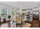 Bright eat-in kitchen boasts stainless steel appliances, granite counters, a view to the deck and backyard at 5384 Gatsby Cir, Rock Hill, SC 29732
