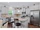 Bright kitchen boasts stainless steel appliances, granite counters, kitchen island with bar stool seating at 5384 Gatsby Cir, Rock Hill, SC 29732