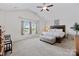 Spacious main bedroom featuring a large window with a window seat, vaulted ceiling, and an ensuite bathroom at 5384 Gatsby Cir, Rock Hill, SC 29732