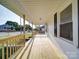 Charming covered front porch offers a relaxing space and street views at 55 Ranlo Ave, Gastonia, NC 28054