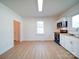 Bright kitchen featuring white cabinets, butcher block countertops, and stainless appliances at 55 Ranlo Ave, Gastonia, NC 28054