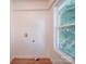 A spacious laundry room with a hookup for a washer and dryer and a large window at 55 Ranlo Ave, Gastonia, NC 28054