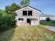 View of the detached two-story outbuilding, adding character to the property at 55 Ranlo Ave, Gastonia, NC 28054