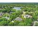 A tranquil lakeside community surrounded by lush green forests and mature trees offers a serene living environment at 5701 Challisford Ln, Charlotte, NC 28226