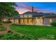 Expansive backyard features covered patio and lush green lawn at 5701 Challisford Ln, Charlotte, NC 28226