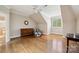 Spacious room featuring hardwood floors, a vintage dresser, and a window with shutters at 5701 Challisford Ln, Charlotte, NC 28226