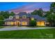 Elegant brick home with a well-manicured lawn and inviting curb appeal at 5701 Challisford Ln, Charlotte, NC 28226