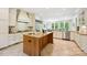 Spacious kitchen features an island with sink, granite countertops, tile floors, and stainless appliances at 5701 Challisford Ln, Charlotte, NC 28226