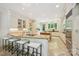 Bright kitchen boasts granite countertops, large island, stainless steel appliances and tile floors at 5701 Challisford Ln, Charlotte, NC 28226
