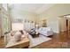 Open living room with built-in shelving, hardwood floors, and lots of natural light at 5701 Challisford Ln, Charlotte, NC 28226