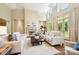 Bright living room with tall ceilings, fireplace, and lots of natural light at 5701 Challisford Ln, Charlotte, NC 28226