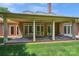 Spacious covered patio overlooking the backyard featuring an outdoor dining area at 5701 Challisford Ln, Charlotte, NC 28226