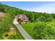 Stunning aerial view of a home nestled among lush trees at 6164 Dwayne Starnes Dr, Hickory, NC 28602