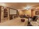 Spacious basement with a home theater setup, comfortable seating, and built-in bookshelves at 6164 Dwayne Starnes Dr, Hickory, NC 28602