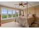 Bright bedroom with a four-poster bed, large window with scenic views, and neutral decor at 6164 Dwayne Starnes Dr, Hickory, NC 28602