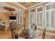 Bright dining area with a glass-top table, wrought iron chairs, and views of the outdoor patio at 6164 Dwayne Starnes Dr, Hickory, NC 28602