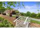 Beautiful home with manicured lawn and charming bridge leading to the property at 6164 Dwayne Starnes Dr, Hickory, NC 28602