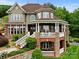 Gorgeous home with brick and stone exterior, detailed trim, a covered porch and immaculate landscaping at 6164 Dwayne Starnes Dr, Hickory, NC 28602