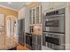 Modern kitchen featuring stainless steel appliances, including a refrigerator, oven, and wine cooler at 6164 Dwayne Starnes Dr, Hickory, NC 28602