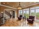 Cozy living room featuring hardwood floors, leather chairs, and large windows with scenic views at 6164 Dwayne Starnes Dr, Hickory, NC 28602