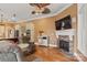 Open-concept living room with a fireplace, hardwood floors, and connection to the kitchen at 6164 Dwayne Starnes Dr, Hickory, NC 28602