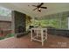 Relaxing outdoor kitchen with stone fireplace and cooking area at 6164 Dwayne Starnes Dr, Hickory, NC 28602