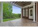 Charming outdoor patio with a pergola overlooking a lush green yard at 6164 Dwayne Starnes Dr, Hickory, NC 28602