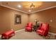 Cozy sitting area with two armchairs, a side table with a lamp, and a comfortable ottoman at 6164 Dwayne Starnes Dr, Hickory, NC 28602