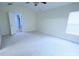 Spacious bedroom featuring neutral carpet, window and en-suite bathroom at 6614 Wicked Oak Ln, Charlotte, NC 28216