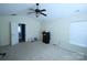 Cozy bedroom with plush carpeting, ceiling fan and access to a closet and other rooms at 6614 Wicked Oak Ln, Charlotte, NC 28216