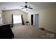 Inviting bedroom offering a ceiling fan, neutral walls, and two door access for versatile use at 6614 Wicked Oak Ln, Charlotte, NC 28216