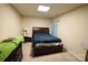 Bedroom featuring carpet, a ceiling light, and a bed with an accent wall at 6614 Wicked Oak Ln, Charlotte, NC 28216