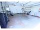 Spacious two car garage with fans, shelving, and storage for tools and equipment at 6614 Wicked Oak Ln, Charlotte, NC 28216