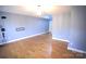 Spacious living room with hardwood floors, offering a versatile layout and ample light at 6614 Wicked Oak Ln, Charlotte, NC 28216