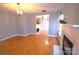 The living room features hardwood floors, fireplace and contemporary lighting at 6614 Wicked Oak Ln, Charlotte, NC 28216