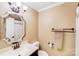 Well-lit bathroom featuring a stylish mirror and vanity, providing a clean and functional space at 6910 Birdsong Ln, Waxhaw, NC 28173