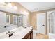 Bright bathroom boasts double sinks, separate tub, and shower, perfect for a relaxing and functional space at 6910 Birdsong Ln, Waxhaw, NC 28173