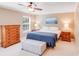 Comfortable bedroom featuring a ceiling fan, natural light, and stylish furnishings for a restful retreat at 6910 Birdsong Ln, Waxhaw, NC 28173