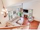 Bright living room with a fireplace, hardwood floors, neutral colors, and lots of natural light at 6910 Birdsong Ln, Waxhaw, NC 28173