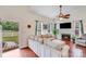 Bright living room showcases a fireplace, hardwood floors, and a comfortable sectional at 6910 Birdsong Ln, Waxhaw, NC 28173