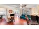 Open living room with hardwood floors, natural light, and access to the breakfast nook at 6910 Birdsong Ln, Waxhaw, NC 28173