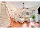 Spacious living room with high ceilings, hardwood floors, and a large window at 6910 Birdsong Ln, Waxhaw, NC 28173