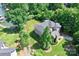 This house features manicured lawn and mature tree coverage to create a private lakeside retreat at 7365 Gabriel St, Sherrills Ford, NC 28673