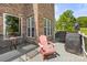 The home's back deck features furniture perfect for relaxing and enjoying outdoor grilling near beautiful lake views at 7365 Gabriel St, Sherrills Ford, NC 28673