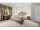 Comfortable bedroom with neutral tones, elegant drapes, and carpet, creating a relaxing atmosphere at 7365 Gabriel St, Sherrills Ford, NC 28673