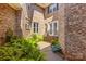 Inviting brick home entrance with mature ferns and manicured landscaping at 7365 Gabriel St, Sherrills Ford, NC 28673